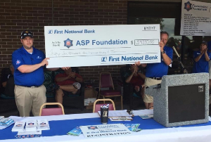image of a giant check of the proceeds from the ASP Foundation Golf Tournament.